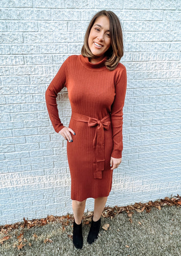 red knit mid dress with bow belt and turtleneck 