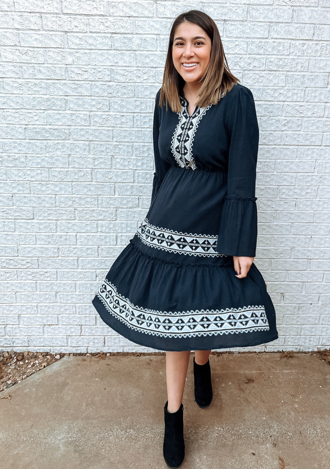 navy midi dress with white embroidery and long sleeves 
